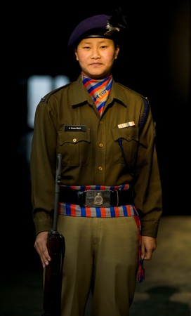 GANGTOK, INDIA - JANUARY 12: A female police officer of Nepali descent stands ready with her rifle January 12, 2008 at Gangtok, Sikkim, Indiaのeditorial素材