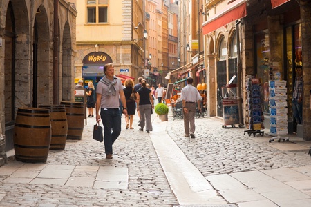 Lyon, France - June 22, 2011:  Shoppers on the main pedestrian shopping street called Rue St. Jean in the old city Vieux Lyon.  The street is a must-see destination for anyone visiting Lyon June 22, 2011 at Lyon Franceのeditorial素材