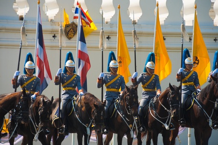 BANGKOK - DECEMBER 5, 2010:  A row of Thai Royal Mounted Guards stand in formation awaiting the King at the King's birthday parade on December 5, 2010 in  Bangkokのeditorial素材