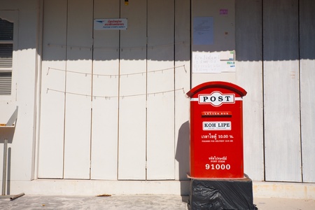 KO LIPE, THAILAND - JANUARY 24, 2010: A Thai Post mailbox sits on a walking street on January 24, 2010 in Ko Lipe, Thailand. Lipe has shot to fame after being in National Geographic Best Trips 2012のeditorial素材