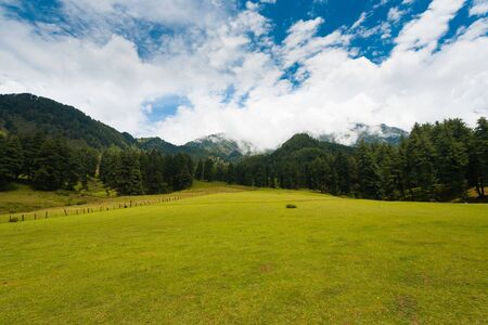 A wide field pasture and beautiful nature of Aru Valley among the mountains of Kashmir in Pahalgam, Indiaの写真素材