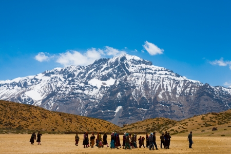 DHANKAR, INDIA - JUNE 7, 2009: An unidentified group of Buddhist pilgrims walk on pilgrimage to a holy lake among the Himalayan mountains in the Spiti Valley on June 7, 2009 in Dhankar, Indiaのeditorial素材