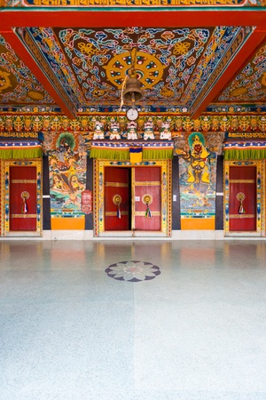 The beautifully decorated doors and ceiling at the entrance to the Rumtek monastery, home of the Karma Kagyu line of Tibetan buddhism, in Gangtok, Sikkim, India.  Verticalのeditorial素材