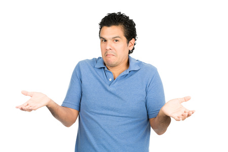 Not sure handsome latino man in casual clothes, throwing hands up, shrugging shoulders showing attitude of uncertainty, indecision, apathy, who caresの写真素材
