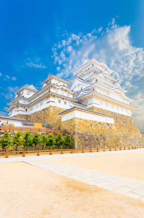 Himeji-jo castle on its high stone base and wide front courtyard on a clear, blue sky day in Himeji, Japan post 2015 renovations completed. Angled vertical copy spaceのeditorial素材