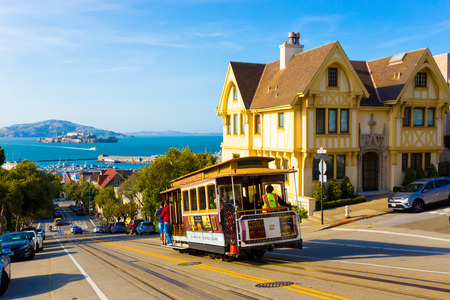 San Francisco, USA - May 12, 2016: Combined scenic view of San Francisco Bay with Alcatraz, cable car, Victorian houses, typical iconic siteseeing landmarks and tourist attractions of the cityのeditorial素材