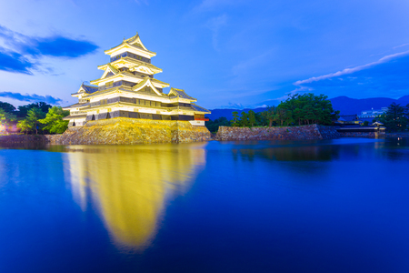 The entrance of Matsumoto Castle illuminated with night lights at blue hour in Nagano Prefecture, Japanのeditorial素材