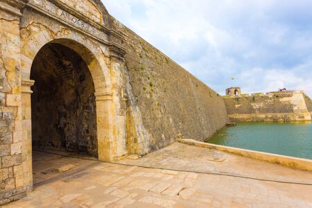 Jaffna Fort entrance and wall bordered by watery moat in Sri Lanka. Angledのeditorial素材