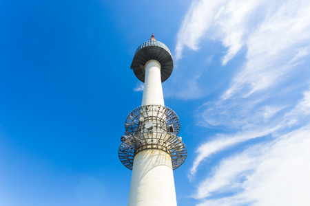Seoul, South Korea - September 18, 2014: Low angle view at base of N Seoul Tower, a tourist landmark atop Namsan mountain on a blue sky day. Horizontalのeditorial素材