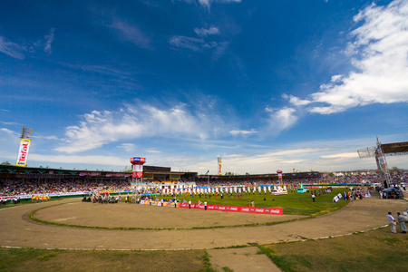 Ulaanbaatar, Mongolia - June 11, 2007: Clear blue sky hovering over the crowded stadium field at the opening ceremony of the Naadam Festivalのeditorial素材