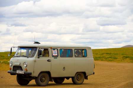 Mongolia - July 16, 2007: Tourists sit in a typical 4 wheel drive UAZ Russian van nicknamed the loaf used to tackle the Mongolian steppe off-roadのeditorial素材