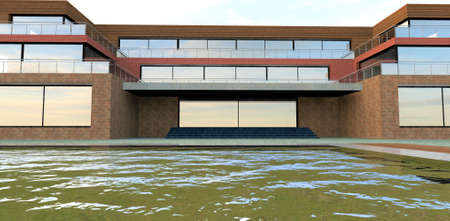 The gloomy autumn sky is reflected in the pool of an advanced three-story building. Wide front entrance with a concrete canopy. The facade is finished with brick. 3d rendering.の写真素材