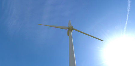 Bottom view of a white fan of an industrial wind turbine against the backdrop of the sun and deep sky. 3d rendering.の写真素材