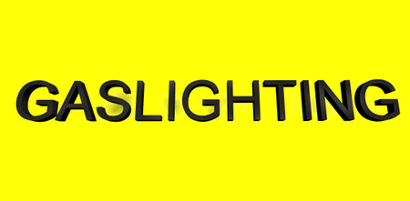 The word Gaslighting written with black letters on the yellow background with dark spots. 3d rendering.の写真素材