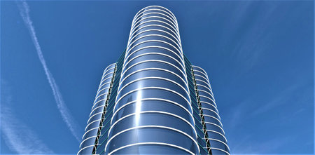 Look from the copter of the contemporary skyscraper with round glass facade. Amazing blue sky with aircraft stripes. 3d rendering.の写真素材