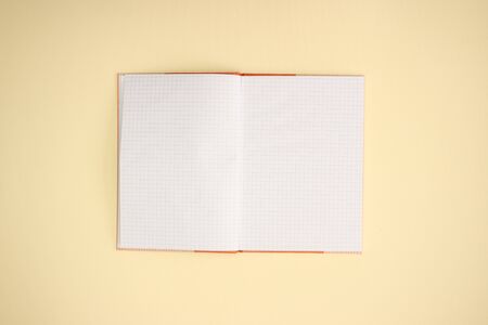 Open notebook on yellow background