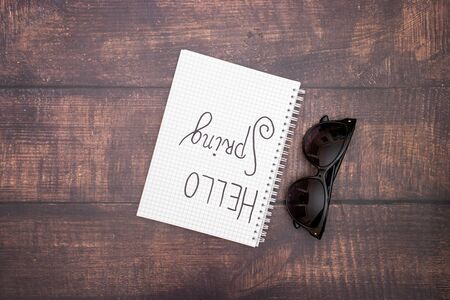 Hello spring on paper and sunglasses