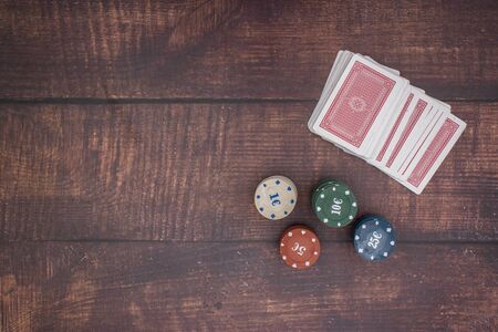 Deck of cards and poker chips on the table