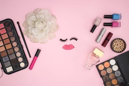 Eye lashes and make up and cosmetics products on pink backgroundの写真素材