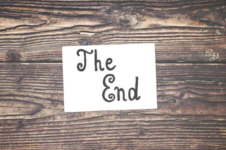 Creative The End sign on the wooden backgroundの写真素材