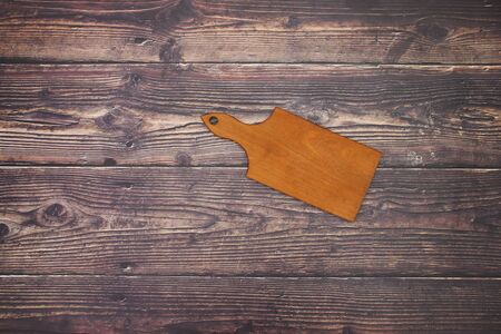Cutting board on wooden table