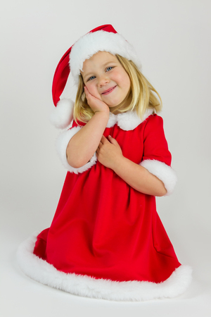 Sweet girl in a red new year capの写真素材