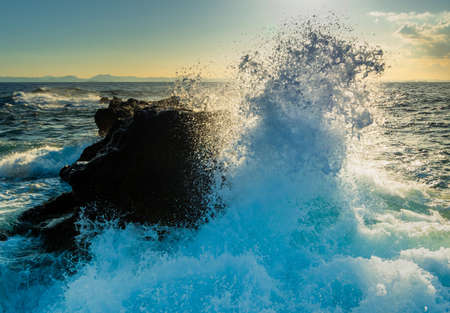 The collision of waves is so enthralling that itâs easy to lose track of time and find yourself stuck out on the outcrop as the tide rises and cuts off all passages to dry land.の写真素材