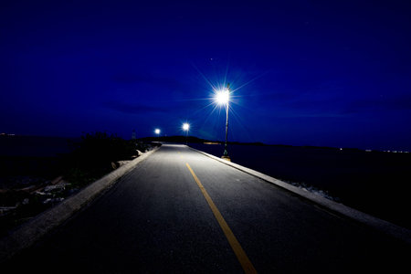 Seafront road at night or Beautiful street at nightの写真素材