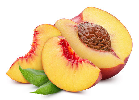 Peach half and slice. Peach with leaves isolated on white background.の写真素材