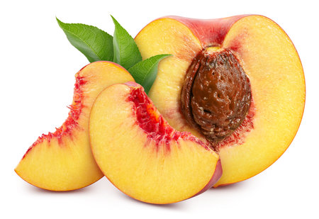 Peach half and slice. Peach with leaves isolated on white background.の写真素材