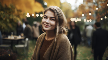 Beautiful young woman in the autumn city. Happy girl on the background of autumn street.の素材