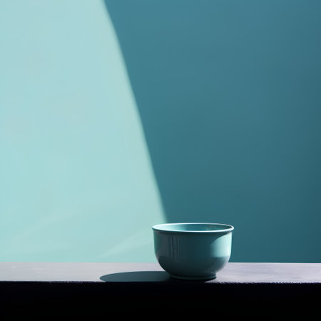 Ceramic cup with shadow on blue wall background. Minimal concept.の素材
