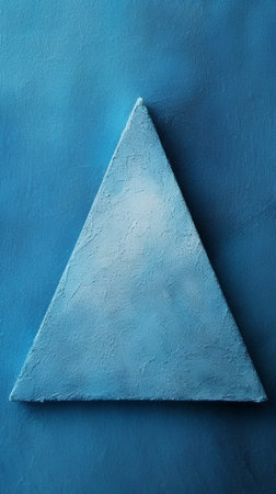 Triangle on blue cement wall. 3D illustration. Abstract background.の素材