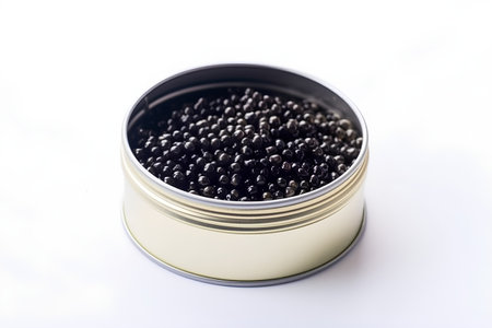 Canned black caviar in a tin can on a white backgroundの素材
