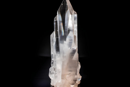 close up of a crystal of quartz on black background with copy spaceの素材