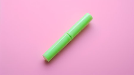 Green highlighter on a pink background. Minimal concept.の素材