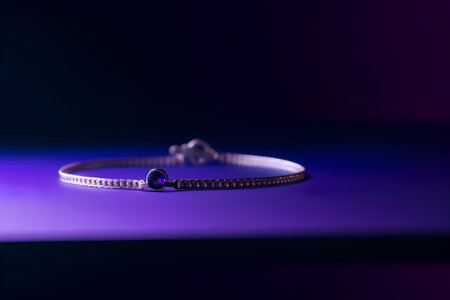 Silver bracelet on a purple background. Jewelry for women. Selective focus.の素材