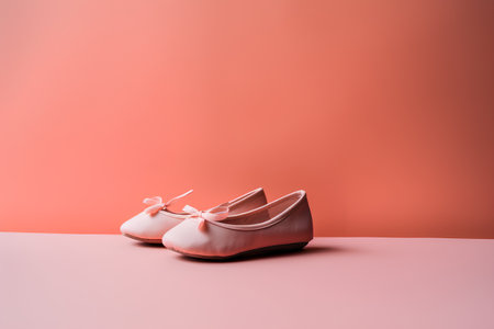 Ballet shoes on pink background with copy space. Ballet school, dance school concept.の素材