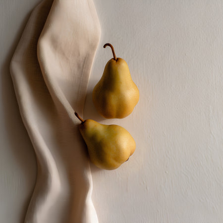Two ripe yellow pears on a white background. Copy space.の素材