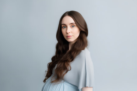 Portrait of a beautiful young brunette woman with long hair.の素材