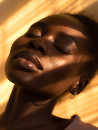 Beautiful african american woman with closed eyes, closeup portraitの素材