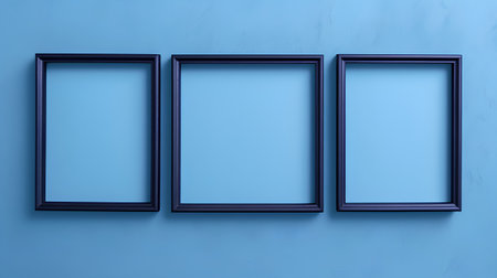 3D render of three blank blue frames leaning on a blue wallの素材