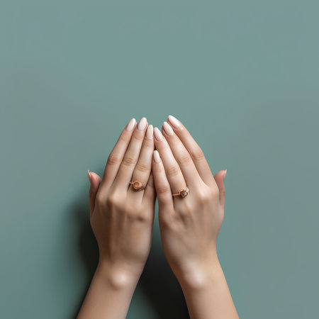 Female hands with beautiful manicure on color background. Manicure conceptの素材