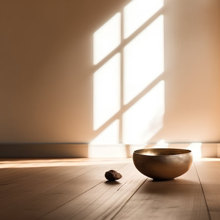 golden bowl on a wooden floor in a room with a windowの素材