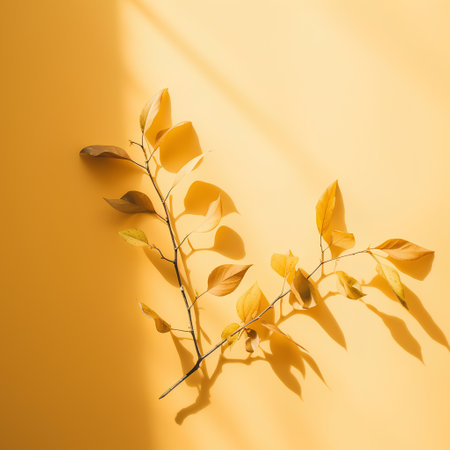 Creative layout made of autumn leaves on yellow background. Minimal autumn concept. Flat lay, top view.の素材