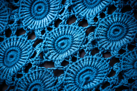 Macro shot of knitted fabric with lace pattern. Blue toned.の素材