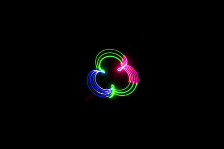 blue rose green mixed light painting photography, long exposure, ripples and waves against a black...
