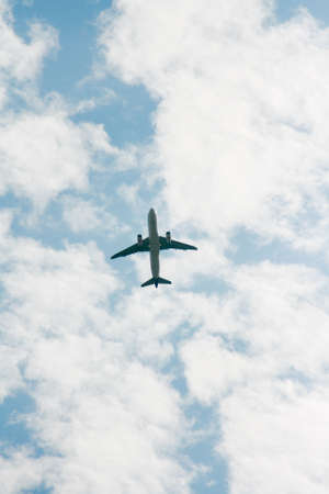 An aeroplane is in the sky.の写真素材