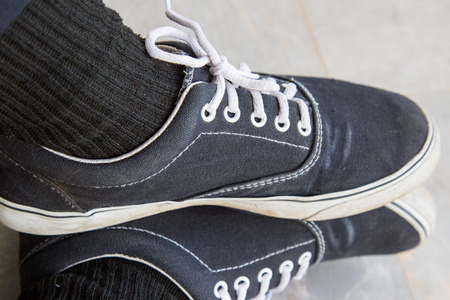 A shoe of man on the floor is a  routine.の写真素材