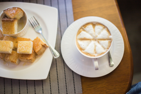 foam coffee with toastの写真素材